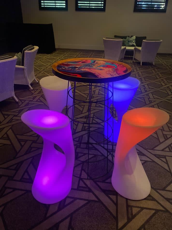 Glow stools and table in a conference room.