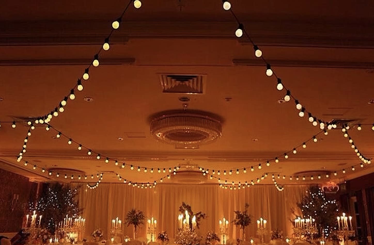 A room adorned with festoon lights, creating a warm and cozy ambiance.