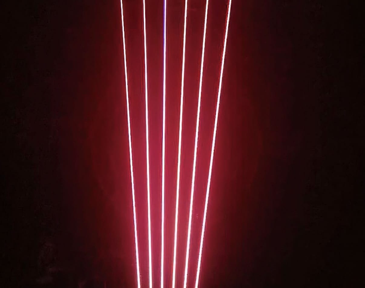 An image of a red light in a dimly lit room.