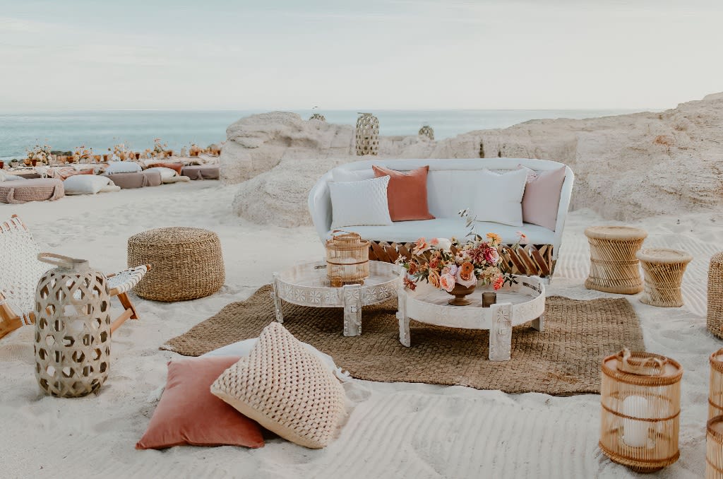 A velvet Ottoman bench on a beach