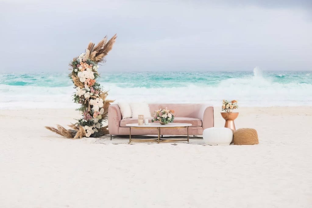 A coastal sofa lounge on a beach