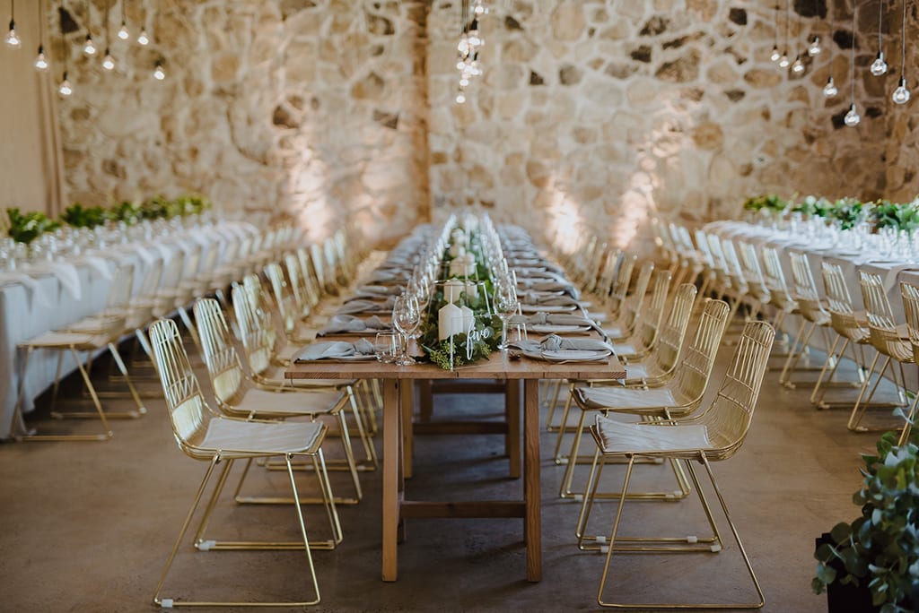 Gold wire chairs set up for a dinner function