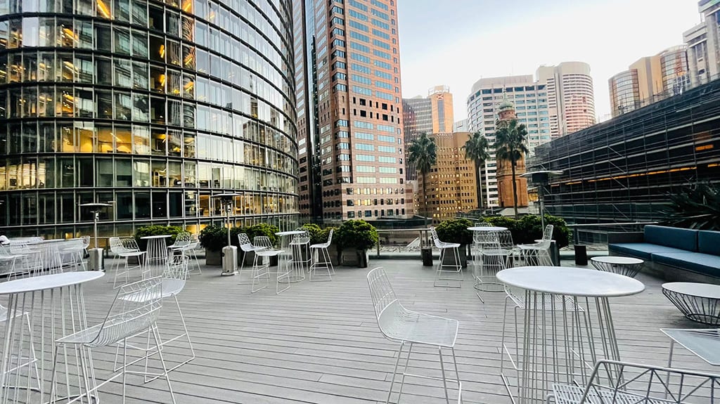 White wire bar stools in an outdoor function area