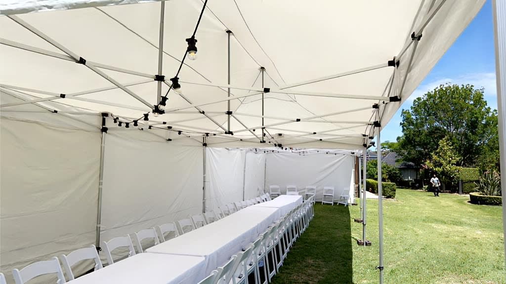 A marquee providing shade for an outdoor event