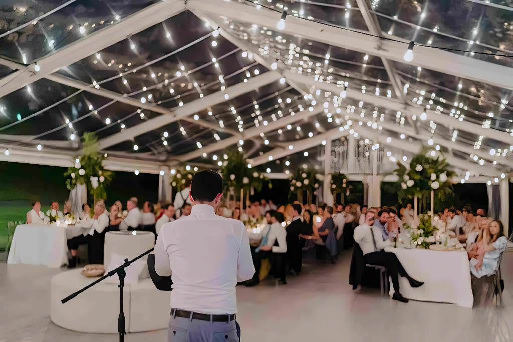 A large marquee with Festoon lighting creating a beautiful atmosphere