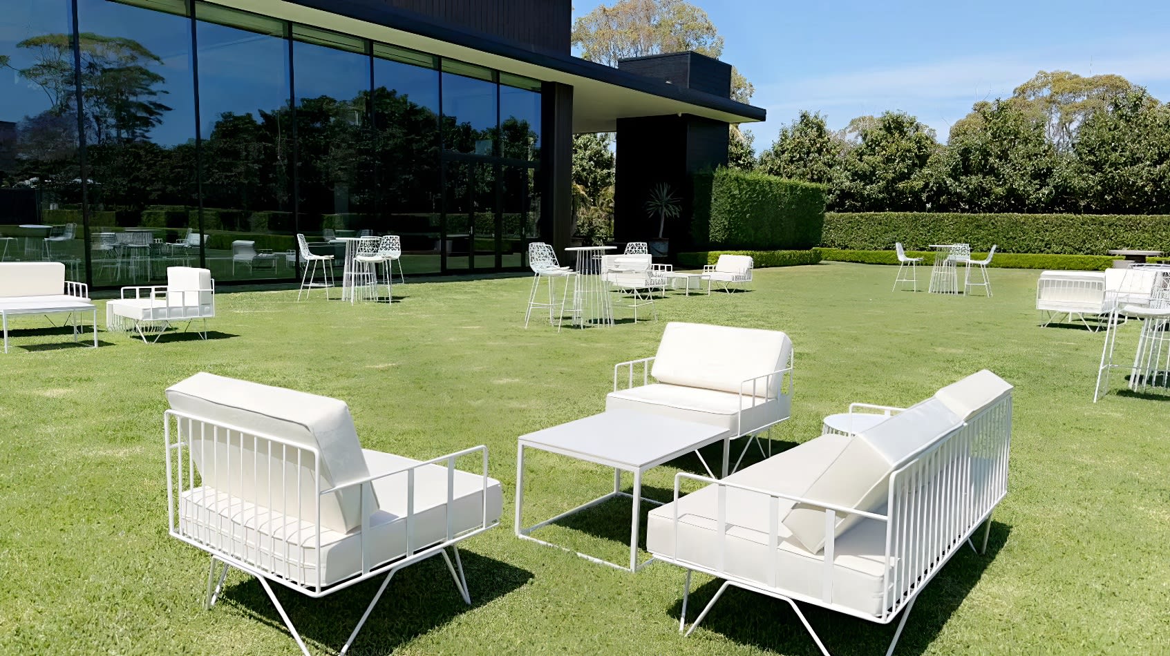 White sofa lounges hired for an outdoor corporate event