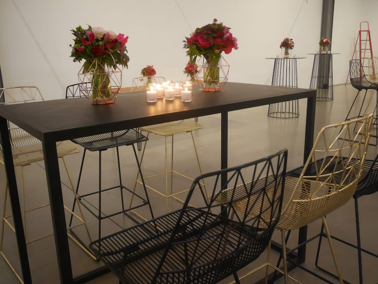 A black Tapas table with candles on it