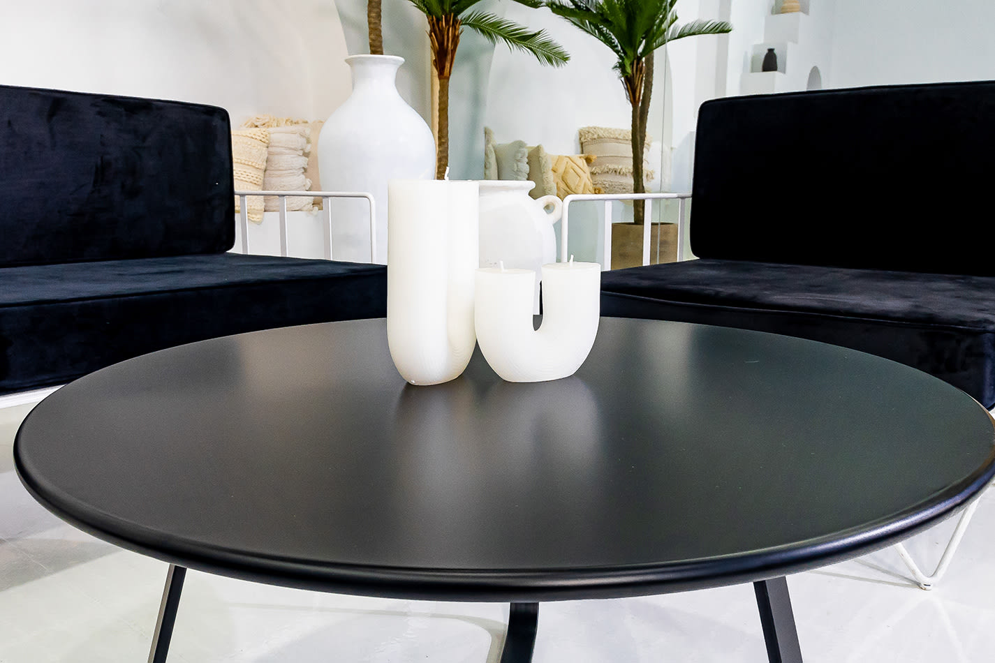 Close-up of the black round coffee table