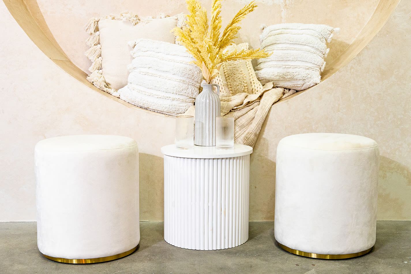 White ottoman stools set up for a party