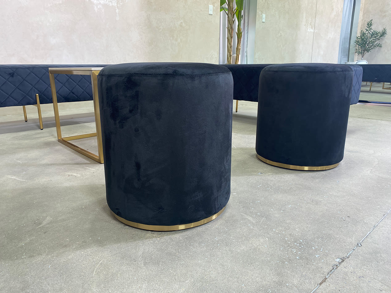 Two black velvet ottoman stools