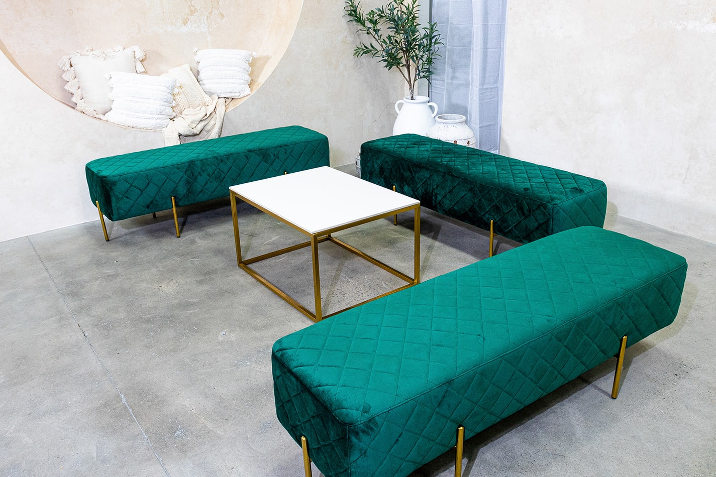 Our emerald green velvet ottoman benches available for hire