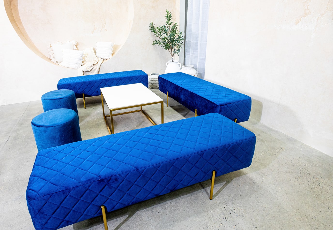 Our navy blue velvet ottoman benches for hire