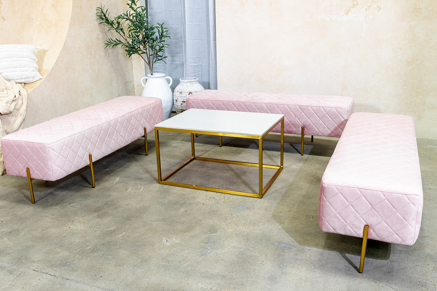 Our pink velvet ottoman benches for hire