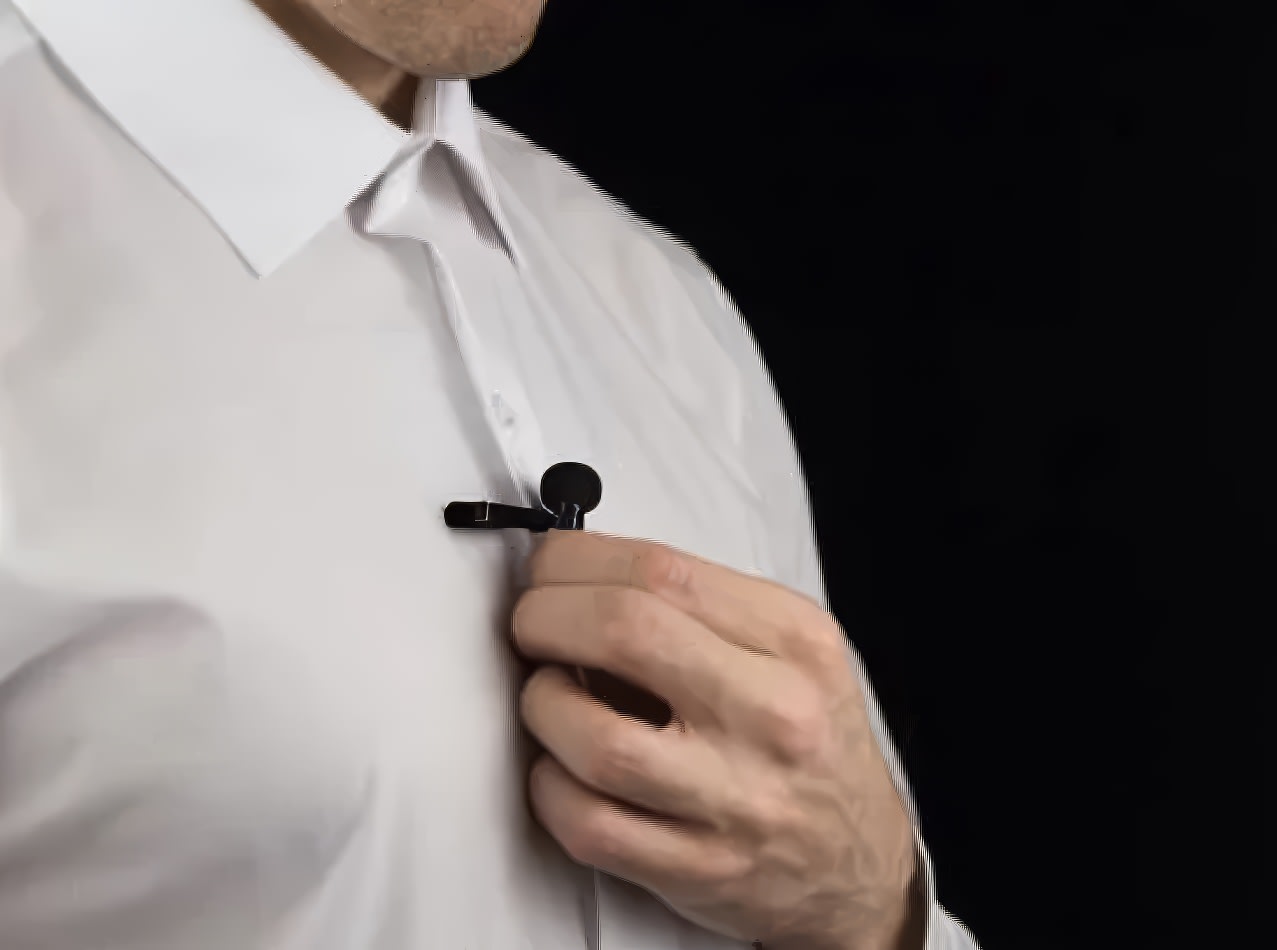 A Shure lapel microphone being used