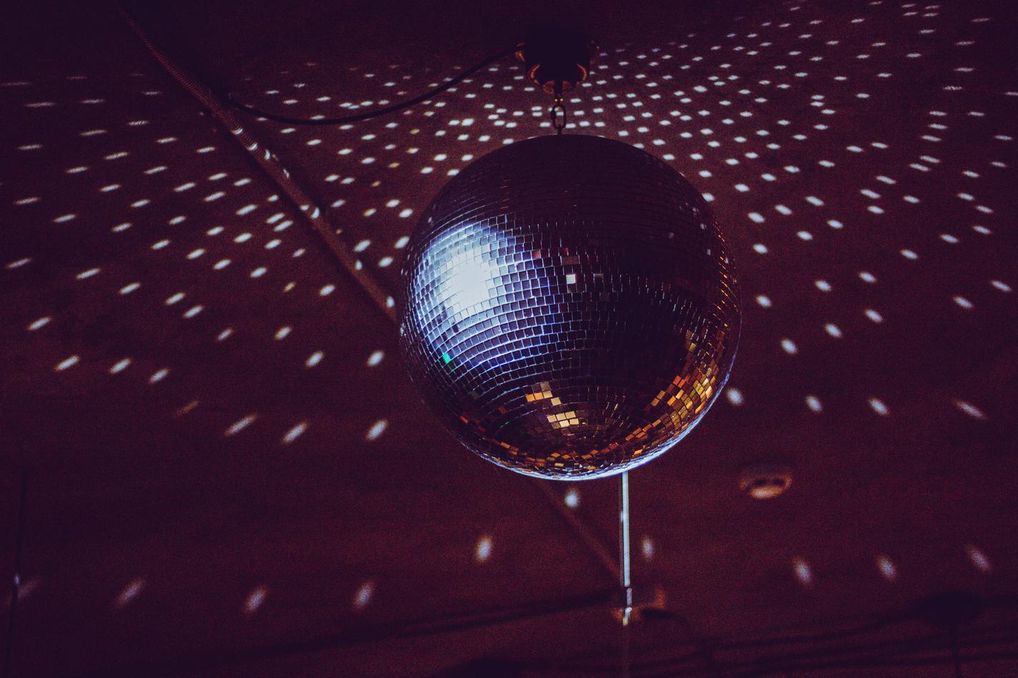 A spinning disco ball with lights