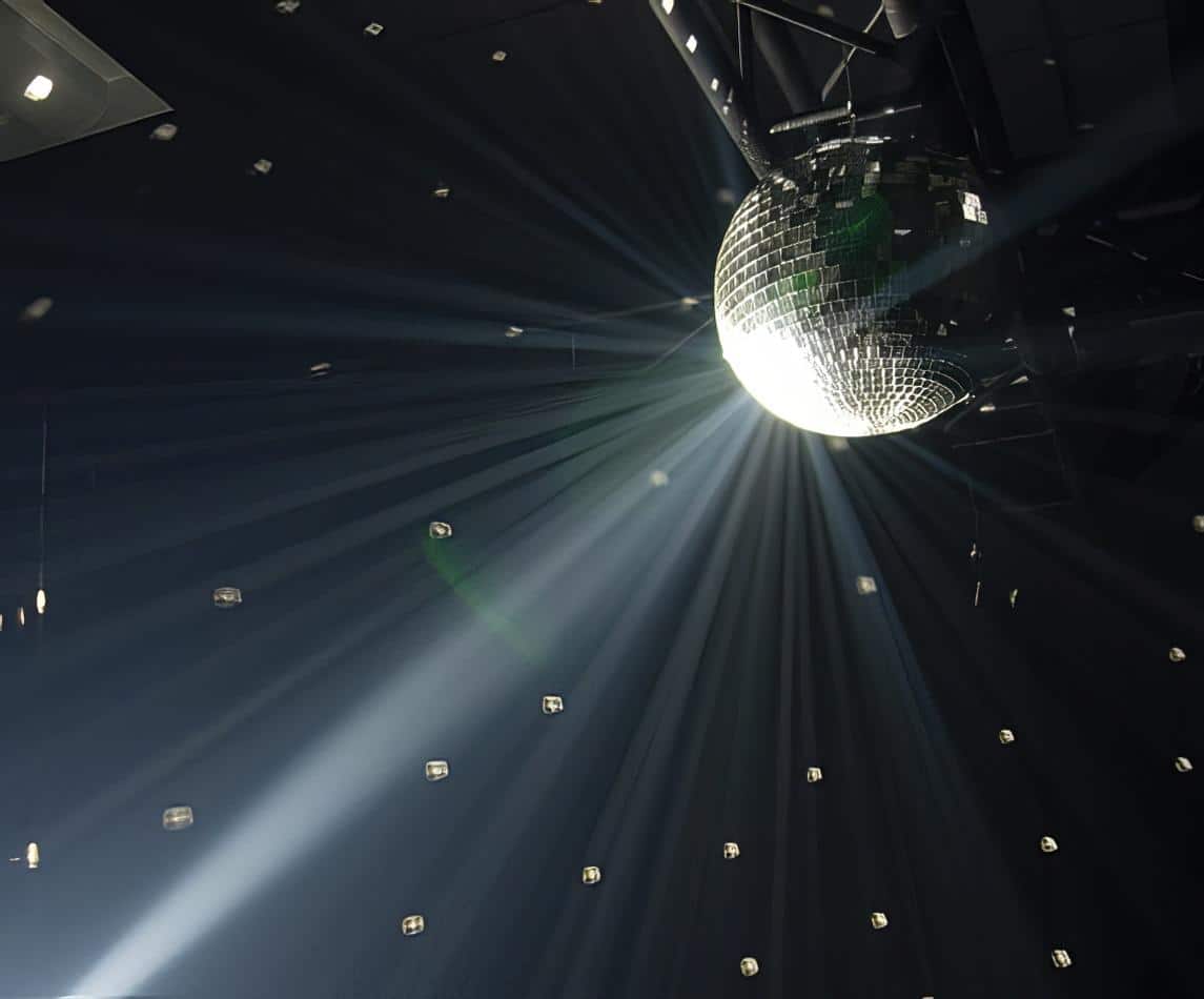 A disco ball with smoke and lighting