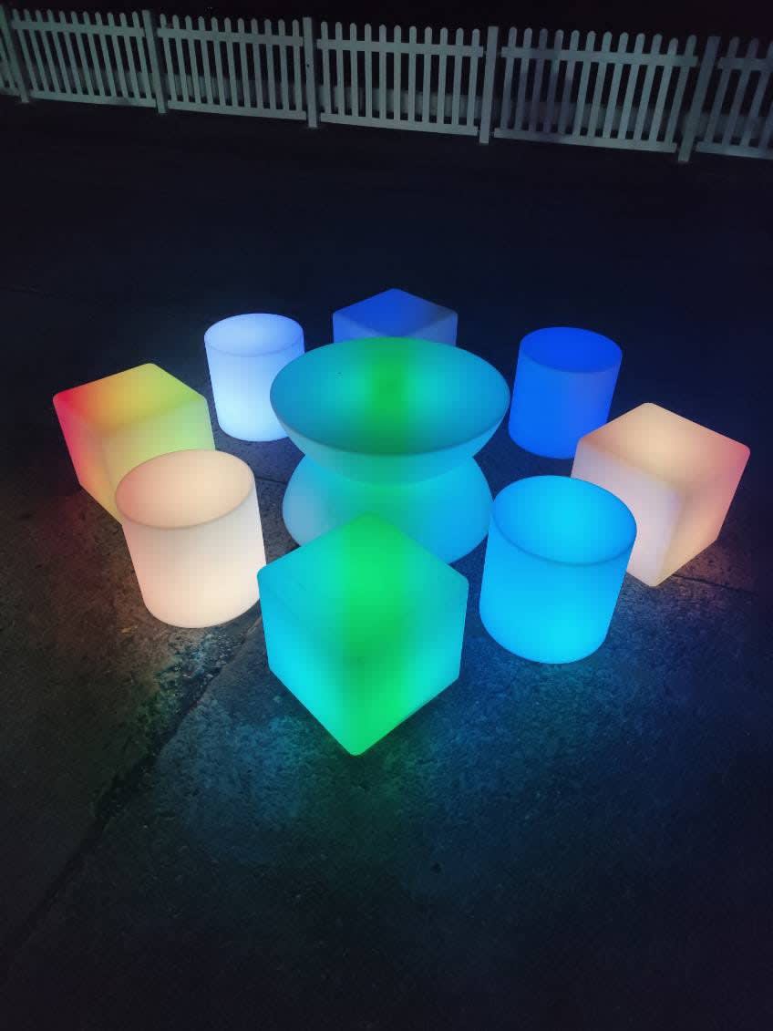 Glow yo-yo coffee table being used outside at night