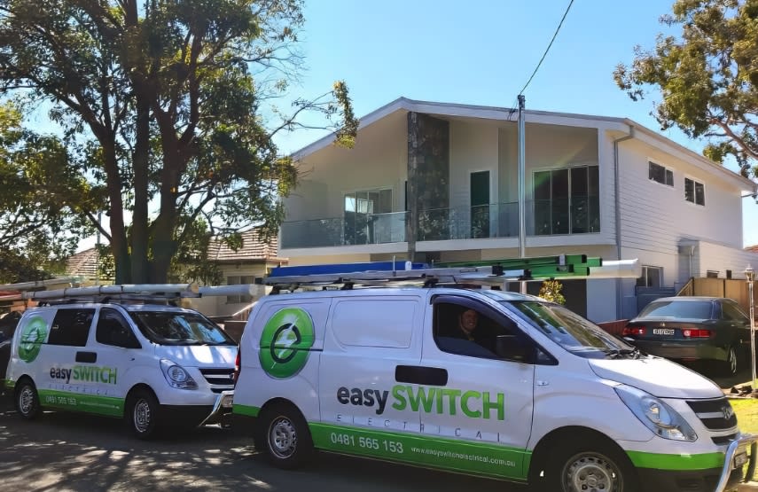 The Easy Switch Electrical vans on a job site