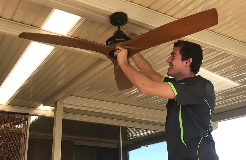 An Easy Switch Electrical electrician performing wiring on a fan