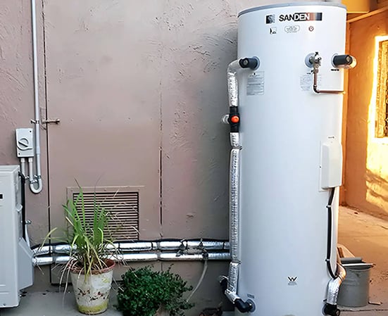 Electrician installing a hot water system in Sydney