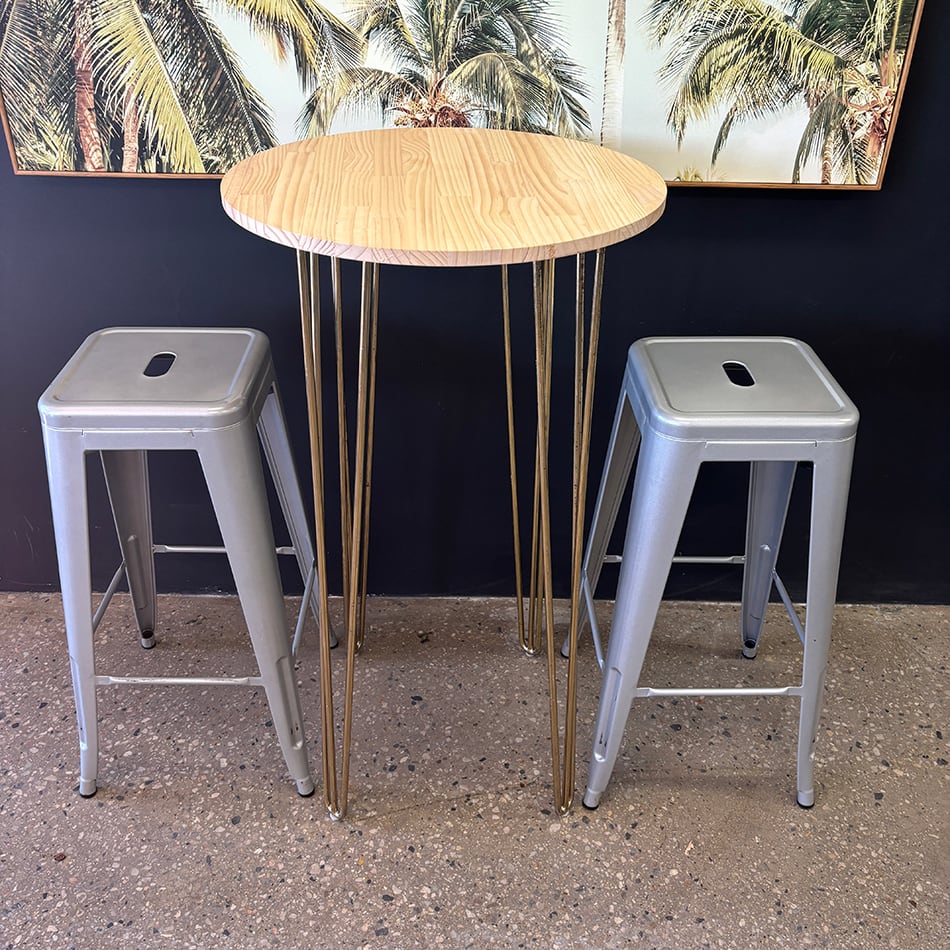Our gold hairpin round cocktail table with Tolix stools