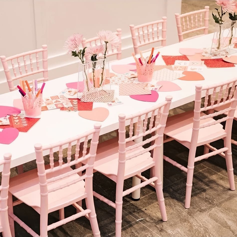 Kids pink Tiffany chairs at a party
