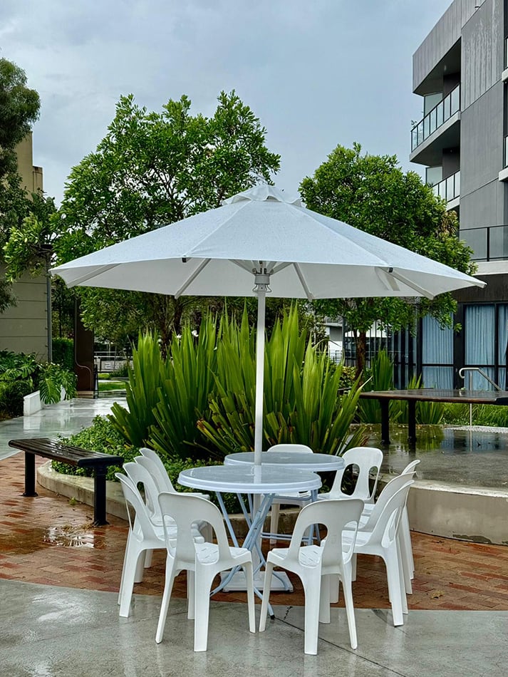 Market umbrellas in an outdoor corporate setting