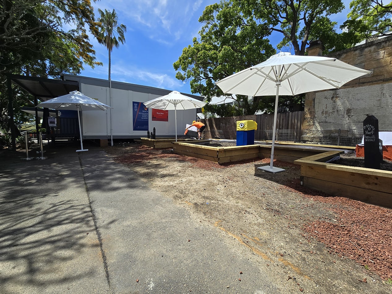 Our market umbrellas being used in an outdoor stall area