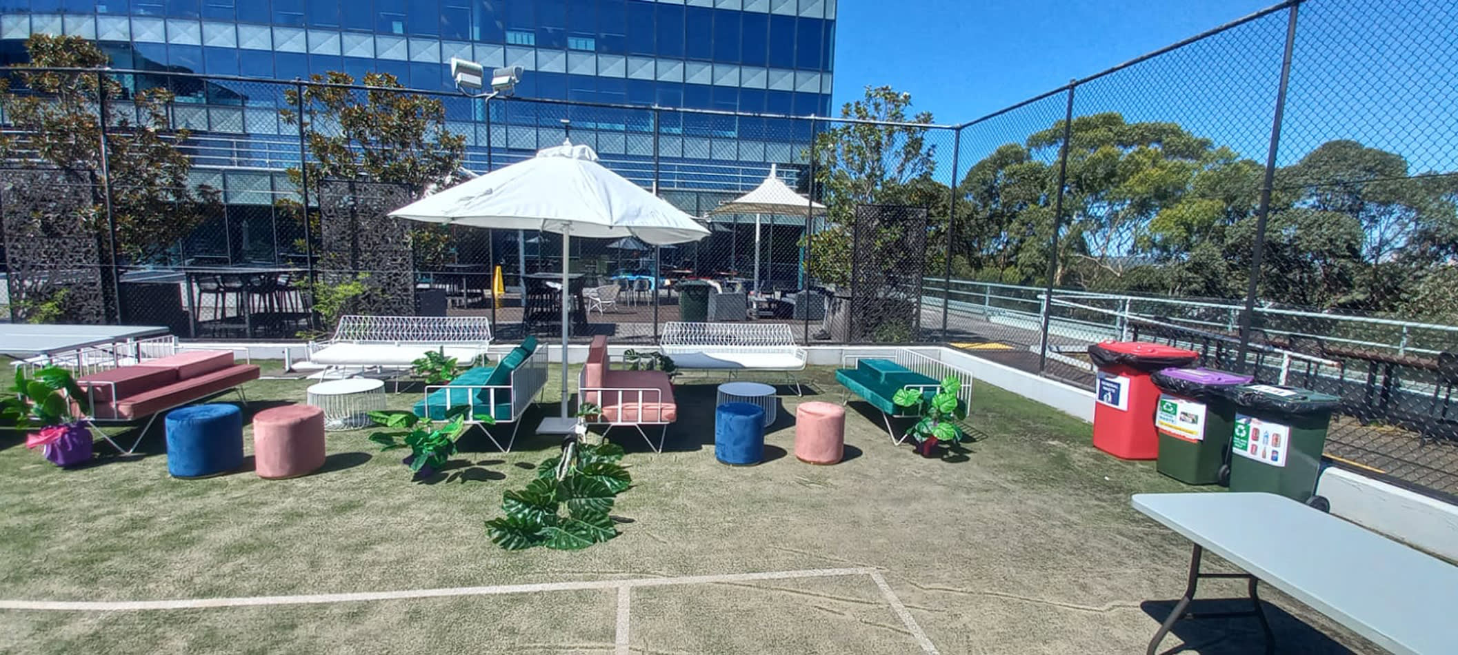 Our premium market umbrella being hired around a tennis court