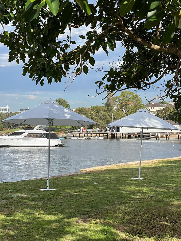 Market umbrellas on the edge of a lake providing shade