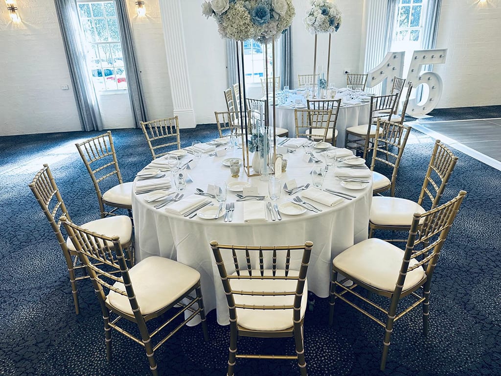 Beautiful gold Tiffany chairs hired for a wedding