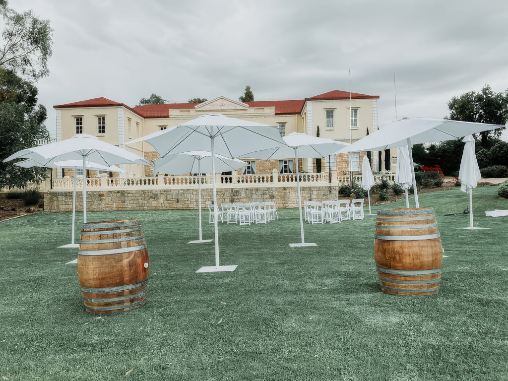 Outdoor umbrellas at an outdoor wedding reception