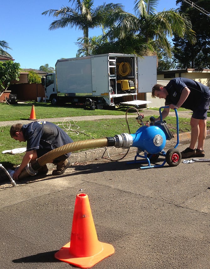 Our team performing pipe relining on a broken pipe