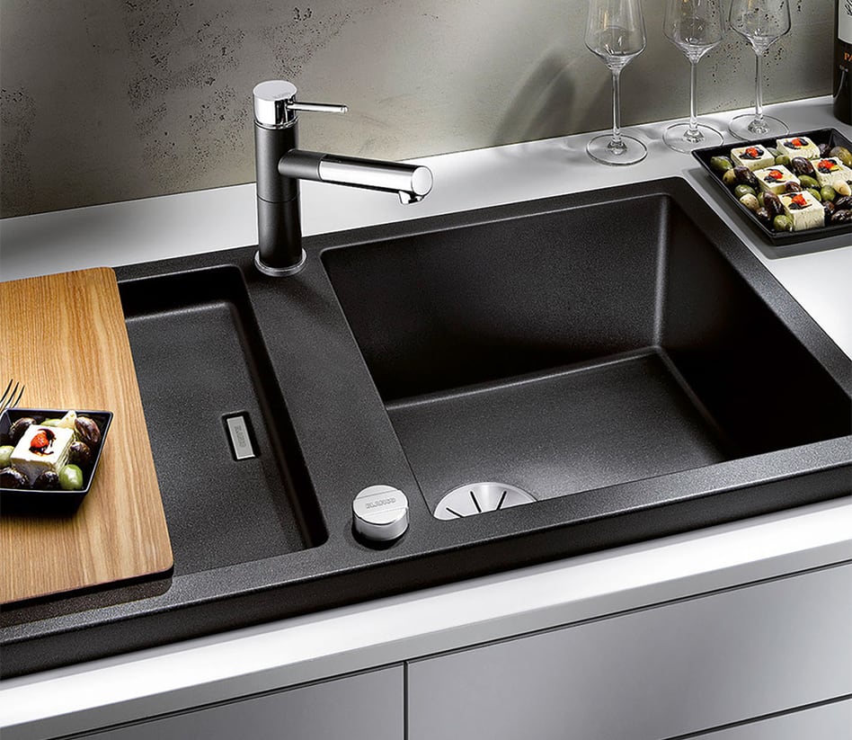 A new modern kitchen sink tap being installation