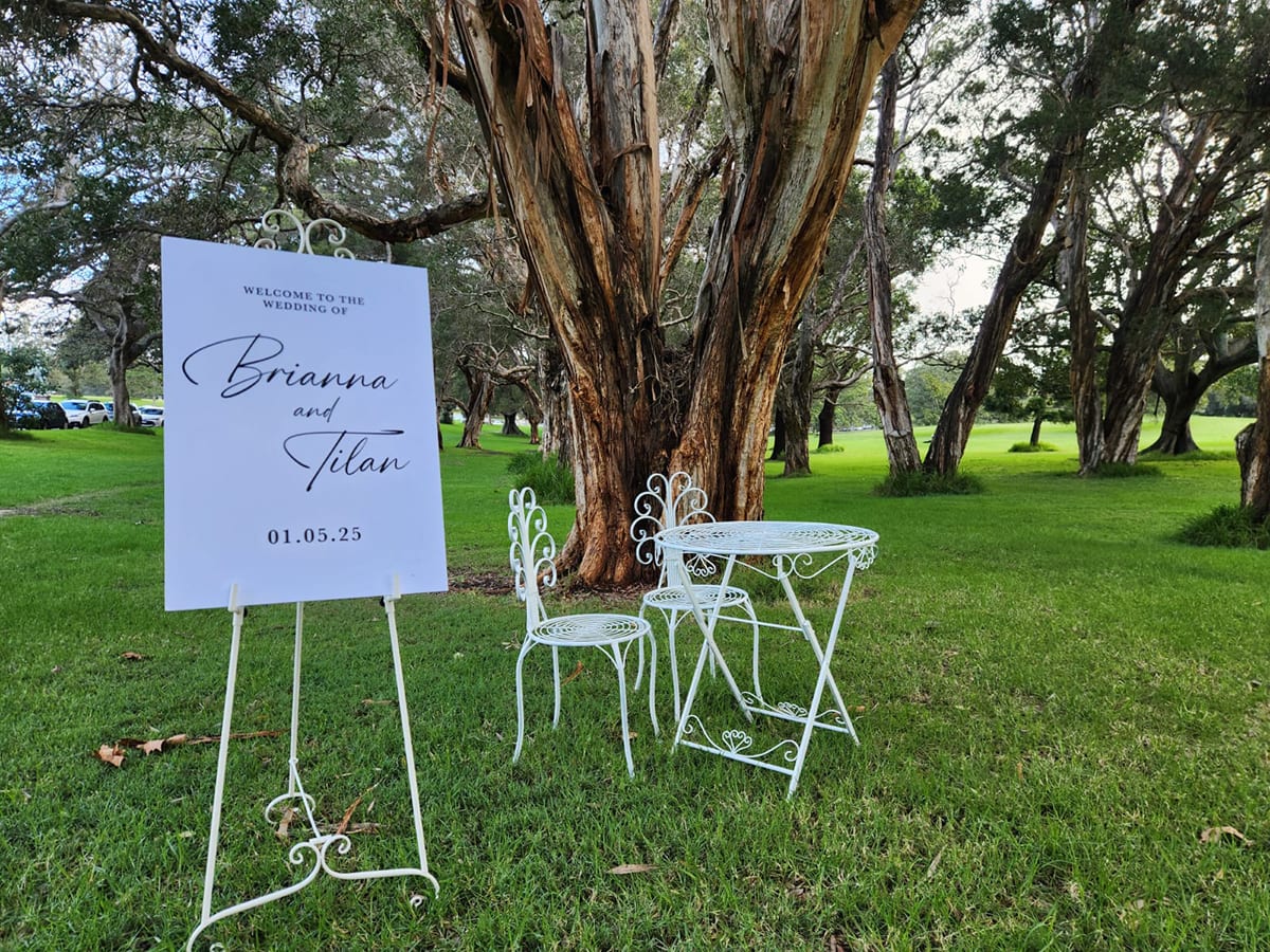An easel used to hold a wedding sign