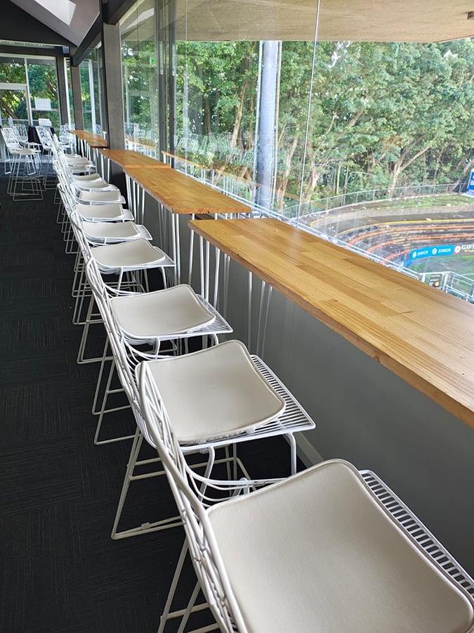 Hairpin timber top tables next door white wire stools