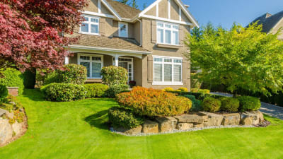 large house with landscaped lawn