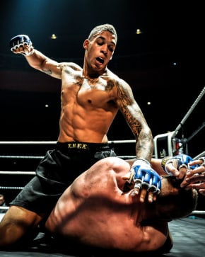 Guy beating opponent on ground