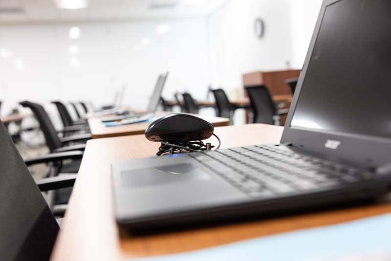 closeup view of laptops on desks