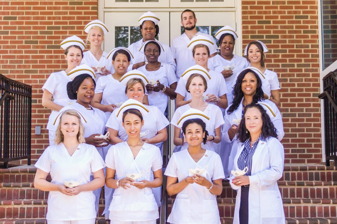 collection of nurses standing outside