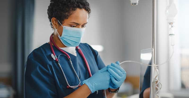 nurse working with lab equipment