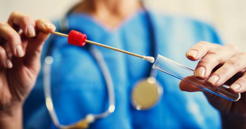 close up of nurse using a test tube