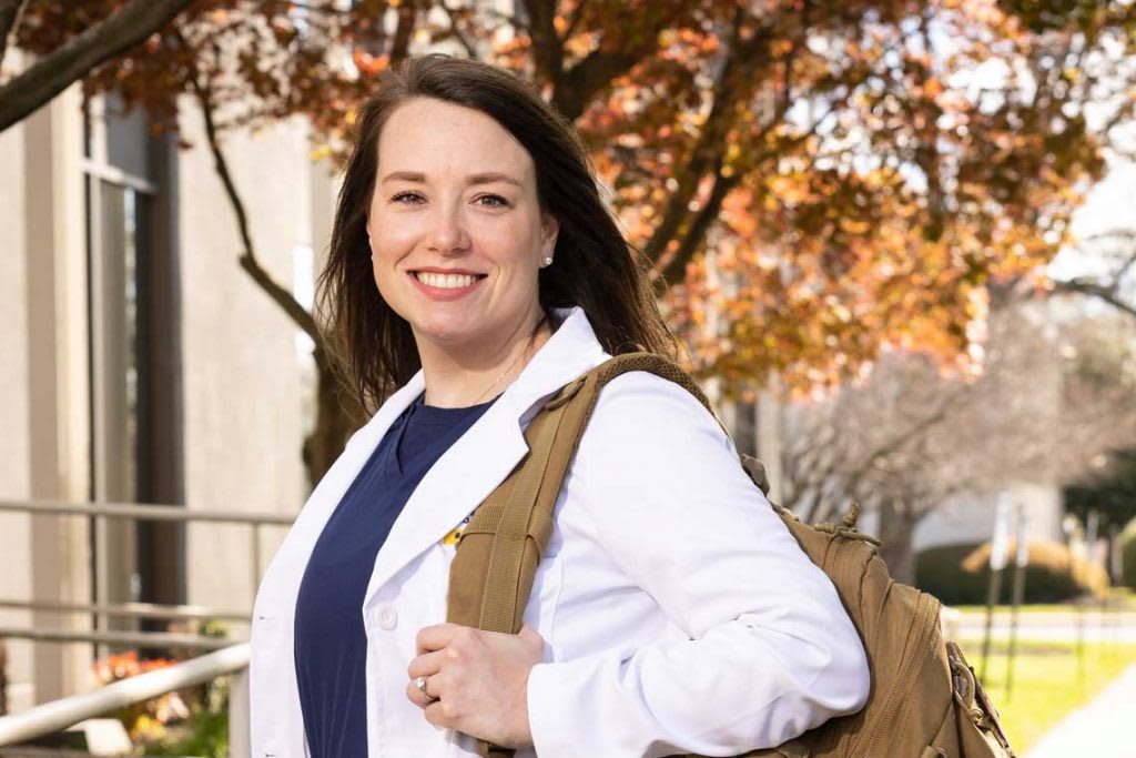 Averett ABSN student walking outside with backpack