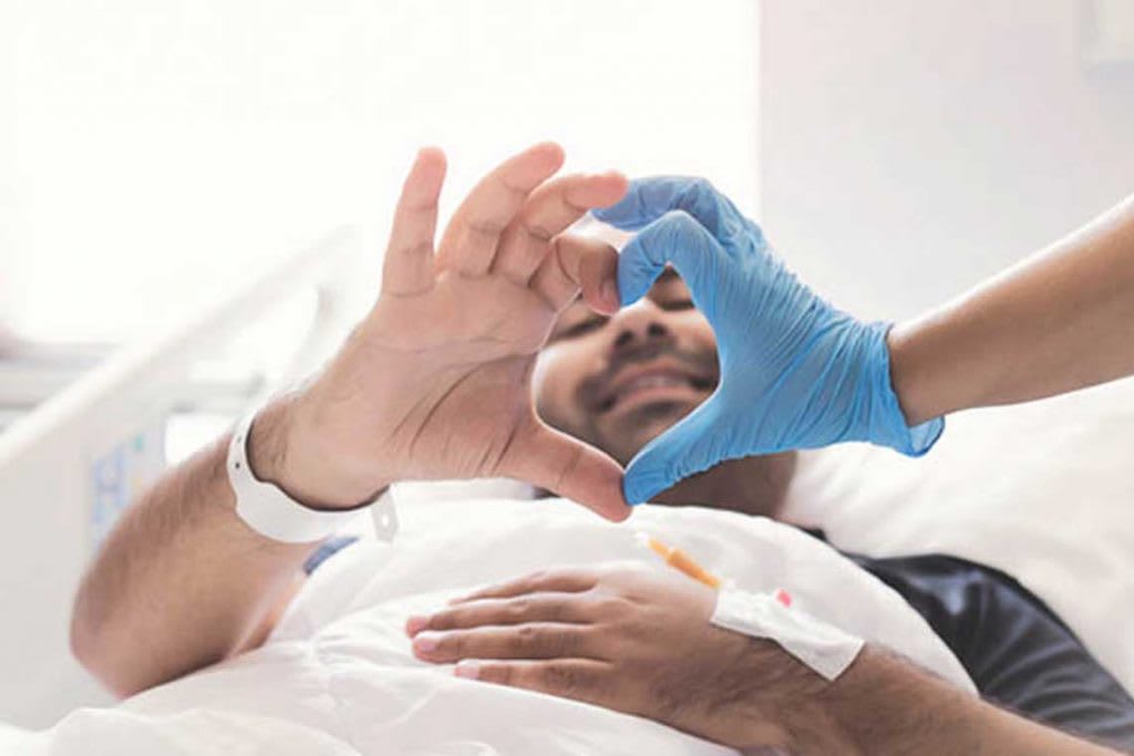 nurse and patient making heart hands