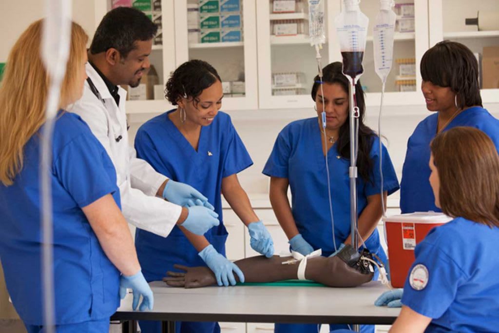 nurses in simulation lab working with tools