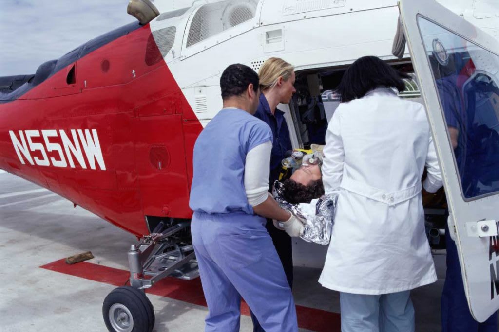 Medavac nurses transporting patient