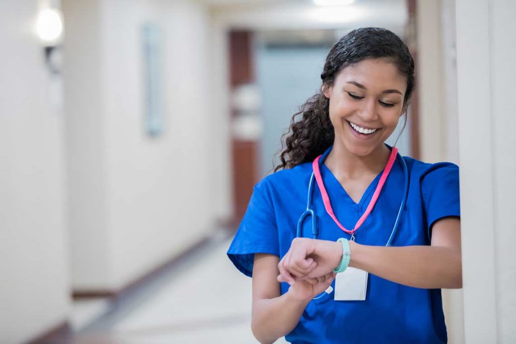 nurse looking at her wrist watch