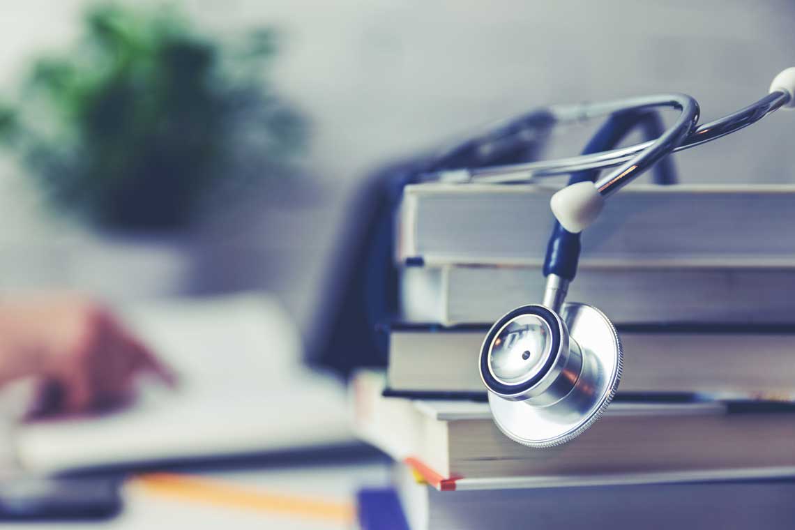 stethoscope on stack of books