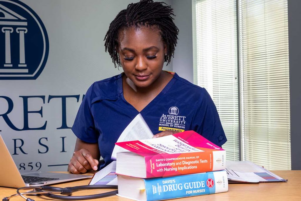 nursing student reading textbooks