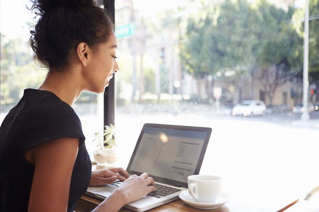 student studying at a coffee shop